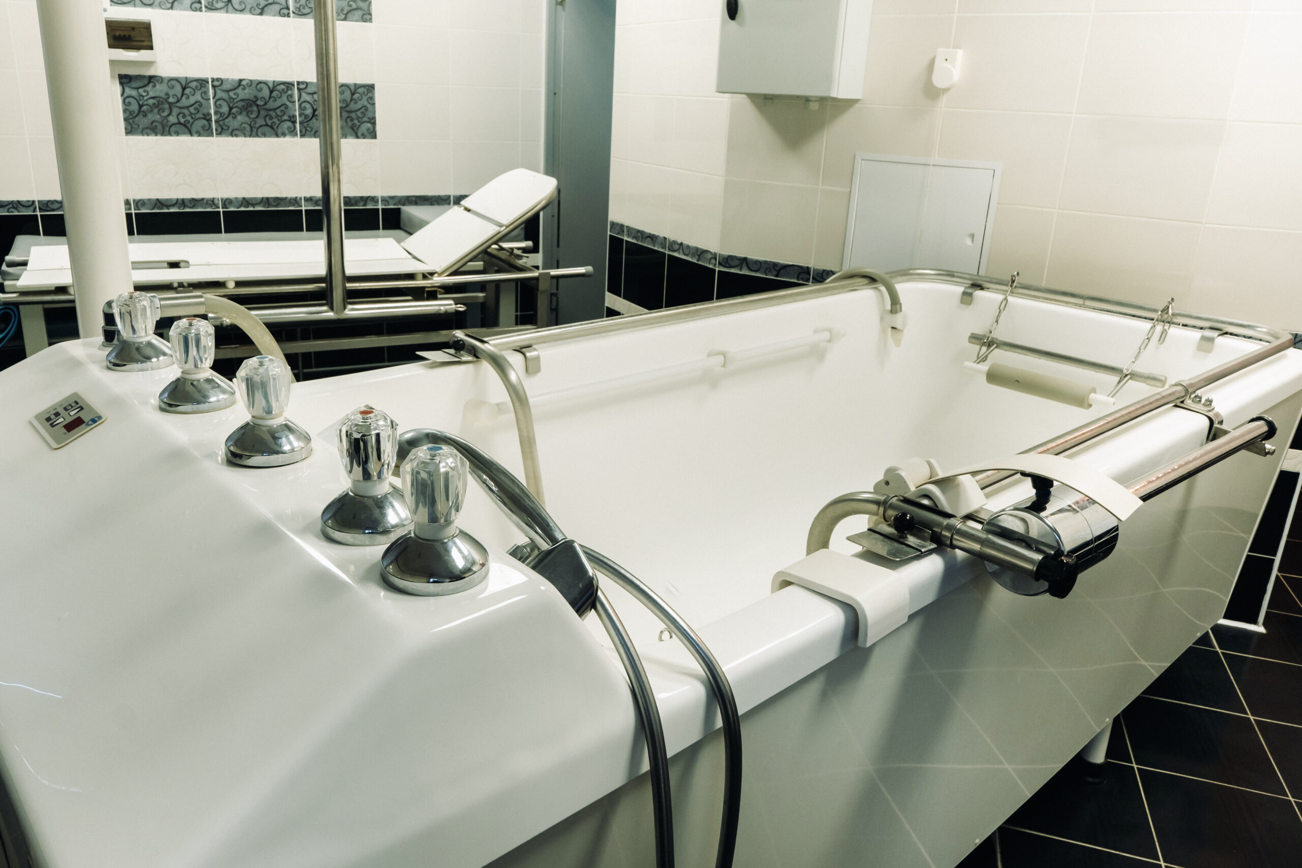 underwater shower bath with massage and stretching on the table in the sanatorium. the office for the procedure underwater massage.